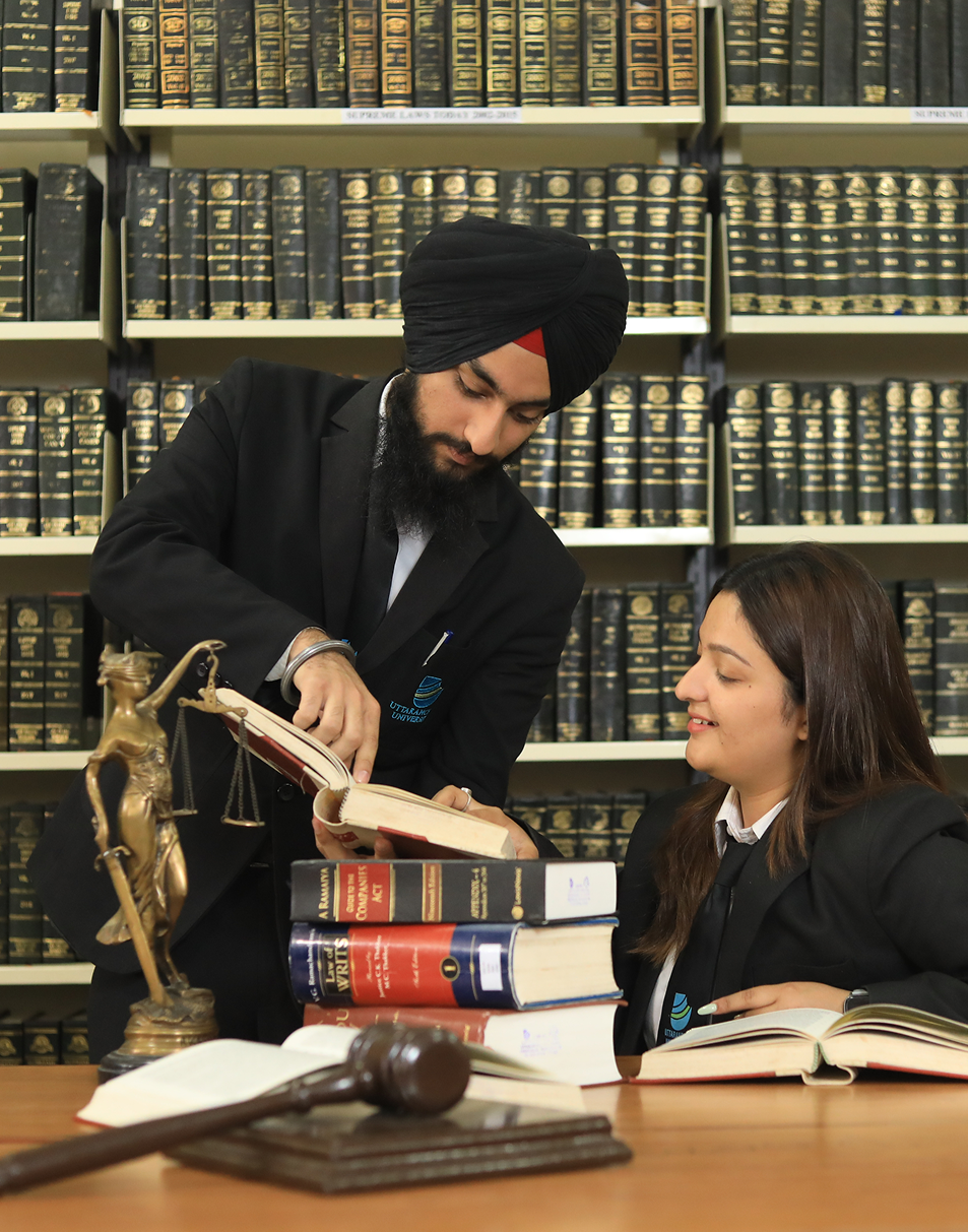 Students studying in university library with books