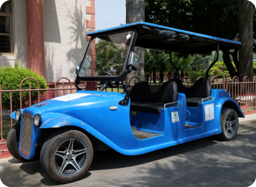 Blue golf cart on campus