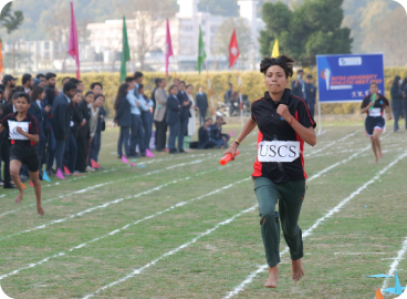 Students running on a sports track