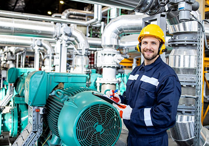 Engineer in a factory with machinery