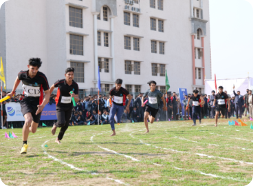 Athletes running on an outdoor sports track